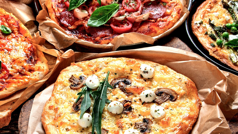 Close up of creative pizzas on a table