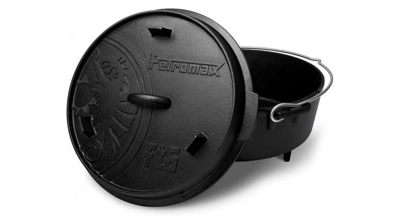 A black Dutch oven with stubby feet that says "Petromax" on the lid, along with the company logo