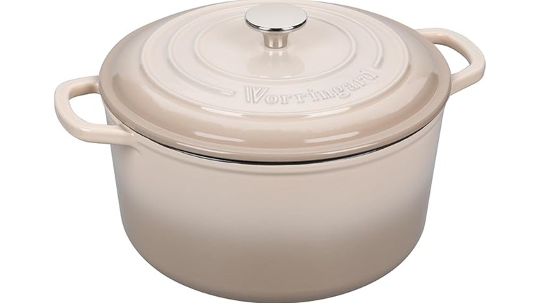 A VORRINGARD enameled Dutch oven in a creamy off-white color against a white background