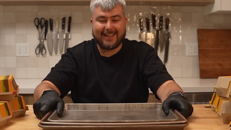 Albert Niazhvinski, creator of albert_cancook, is seen in a still from one of his videos