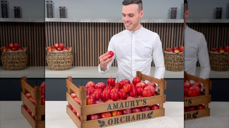 Amaury Guichon holds a pastry apple in his "Crate of Apples" YouTube video