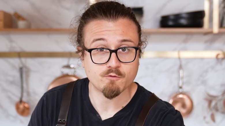Joshua Weissman, a popular YouTube chef, is seen in a still from one of his videos