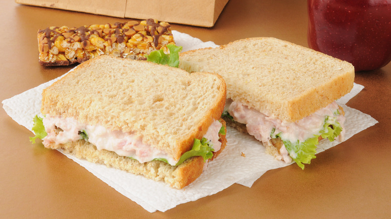 A deviled ham sandwich with a granola bar