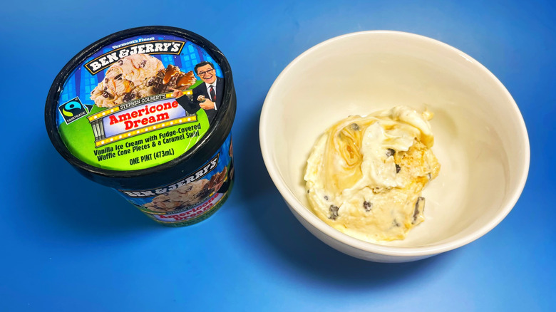 A scoop of Americone Dream in a bowl next to its container
