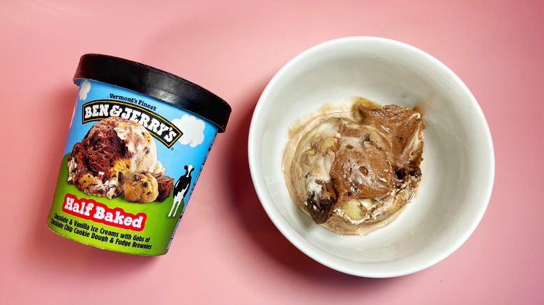 A scoop of Half Baked in a bowl next to its container