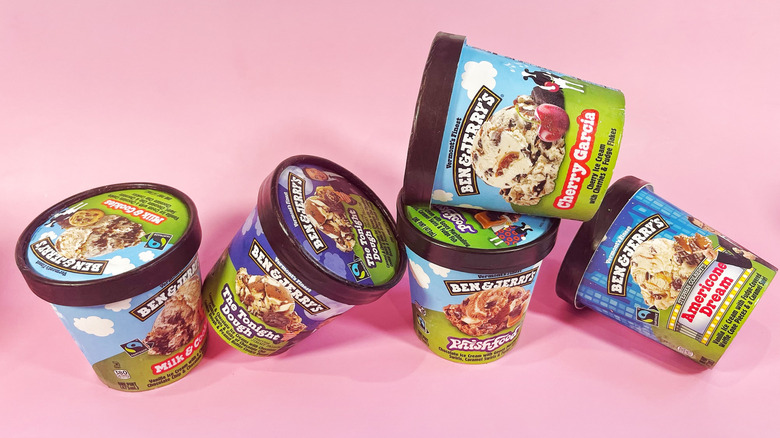 Five pints of various flavors of Ben & Jerry's stacked at odd angles