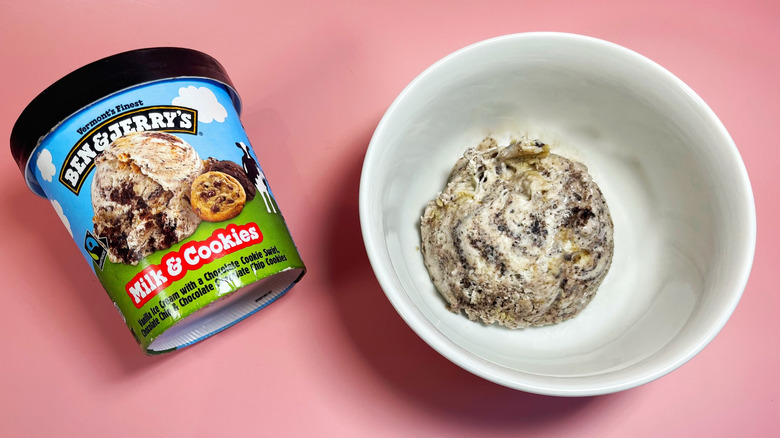 A scoop of Milk & Cookies in a bowl next to its container
