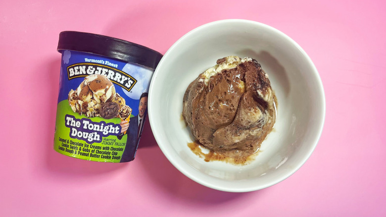 A scoop of The Tonight Dough in a bowl next to its container