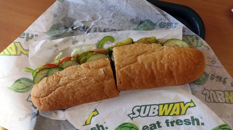 A footlong sandwich from Subway on a table