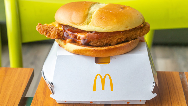 McDonald's McCrispy on a McDonald's box, all placed on a wooden table