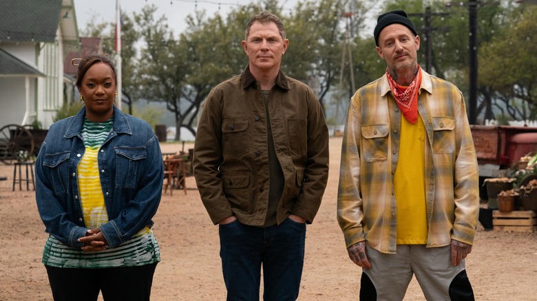 Sunny Anderson, Bobby Flay, and Michael Voltaggio looking serious in "BBQ Brawl"