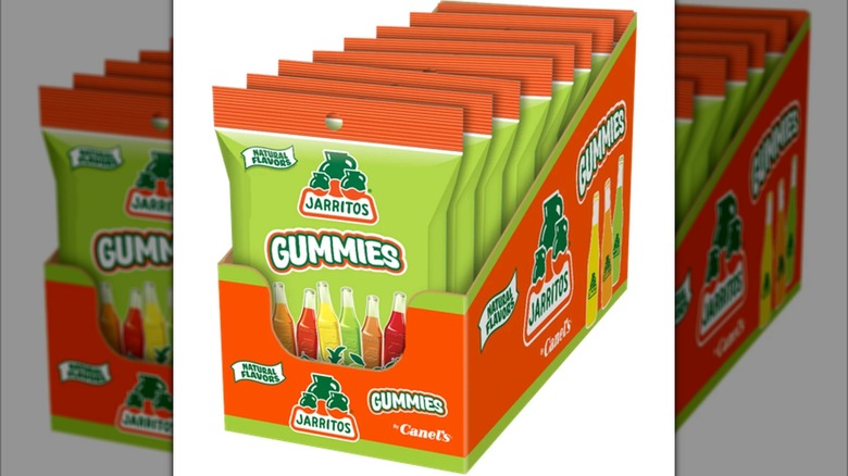 A 12 count box of Jarritos gummies in orange and green bags