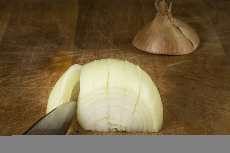 https://www.thedailymeal.com/img/gallery/10-proven-ways-to-cut-an-onion-without-crying/0-INTRO-onion-knife-Istoc-thinkstock.jpg