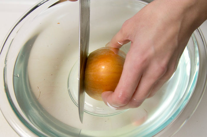 https://www.thedailymeal.com/img/gallery/10-proven-ways-to-cut-an-onion-without-crying/1-water-onion--aureliejouan.jpg