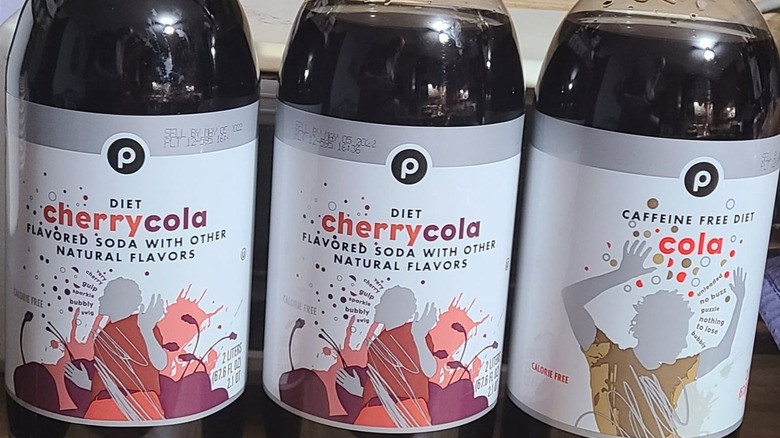 2-liter bottles of Publix cherry cola and Publix caffeine-free diet cola lined up side by side