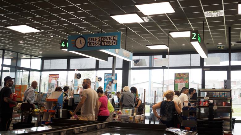 interior view of a crowded aldi cashier area