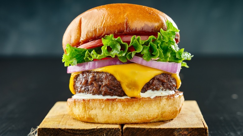 cheeseburger on wooden board