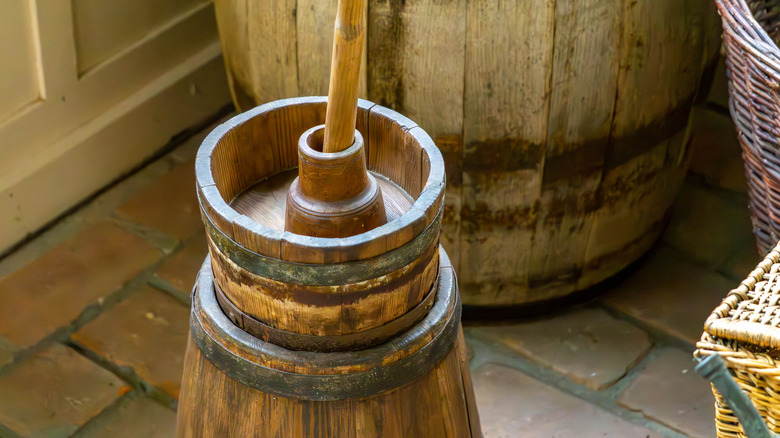 Close-up on a wooden butter-churn with paddle