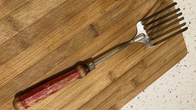 Foley fork laid on wooden surface