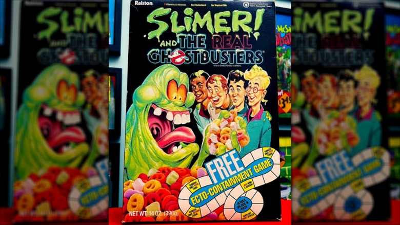90s ghostbusters cereal box feturing slimer holding cereal and four people