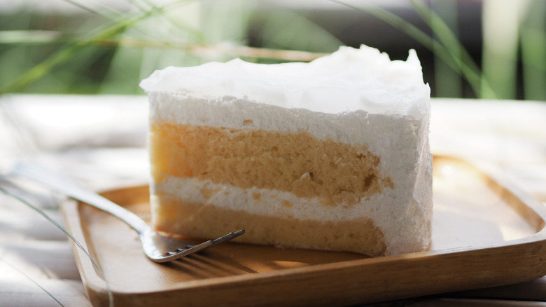 A slice of cake with white frosting