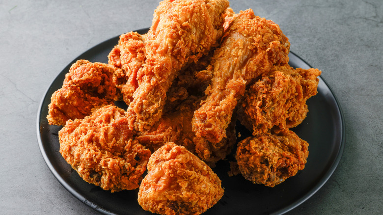 Fried chicken on a black plate
