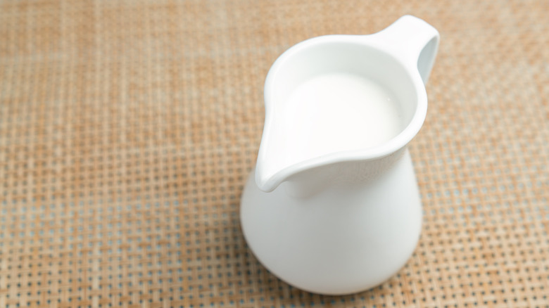 Milk jug with milk inside