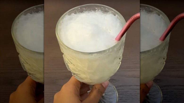 A hand holds a 7-Up Float