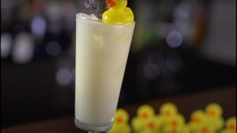 A Fluffy Duck cocktail topped with a small plastic duck
