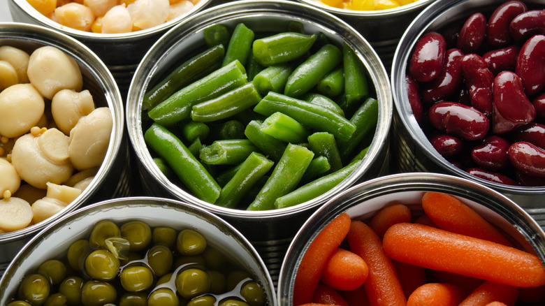 Various open cans of vegetables
