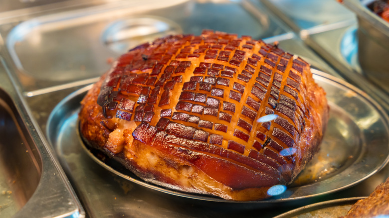 Glazed roasted ham with a crispy exterior