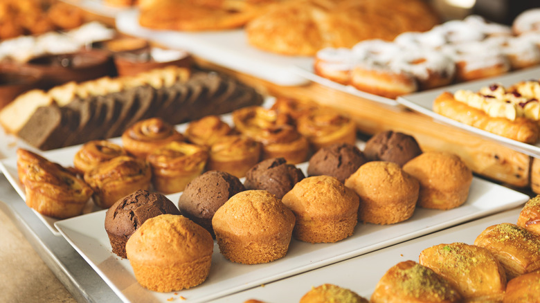 A variety of freshly-baked pastries laid out in a bakery