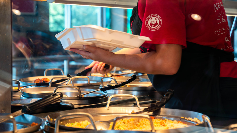 An employee prepares food at Panda Express