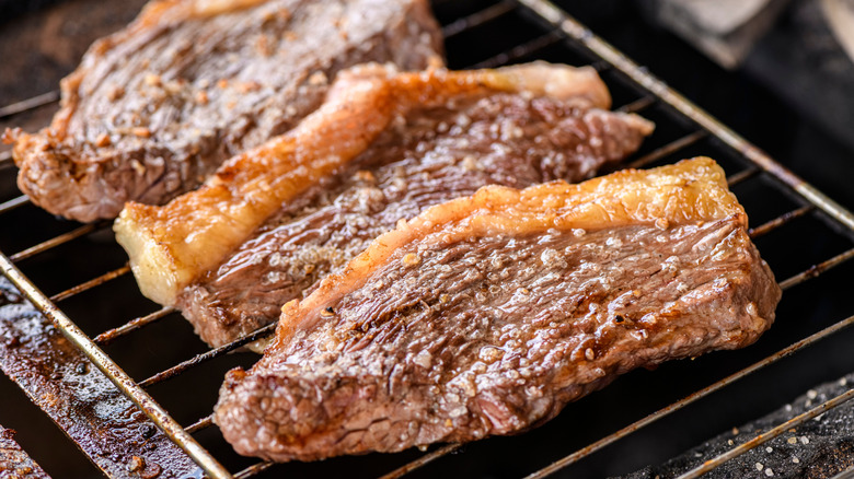 Grilled steaks on a churrasco grill