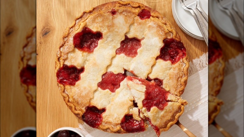 Member's Mark Cherry Lattice Pie viewed from above with spatula lifting out triangular piece