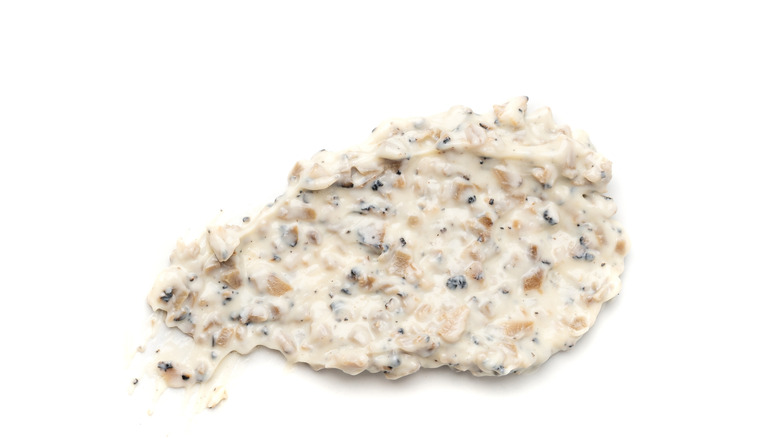 Creamy truffle sauce smeared on a white table