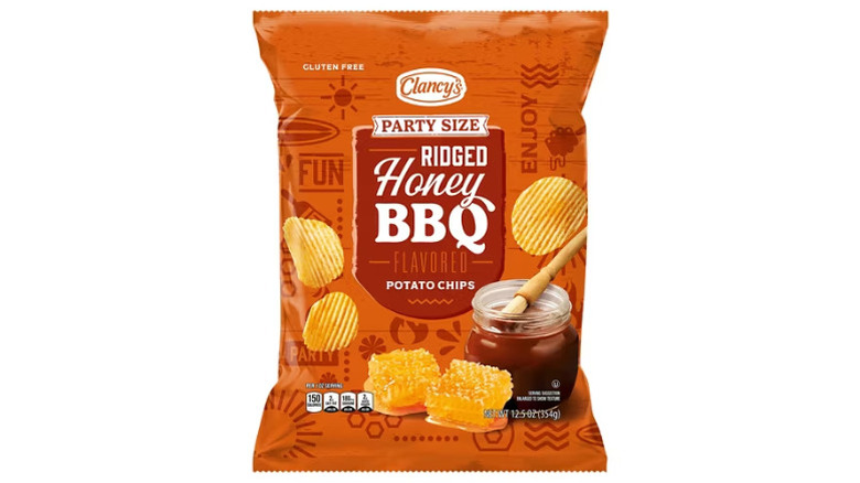 a bag of Clancy's party size honey BBQ ridged potato chips against a white background