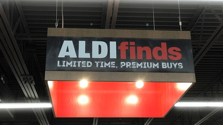 a hanging sign inside an Aldi reading Aldi finds limited time premium buys