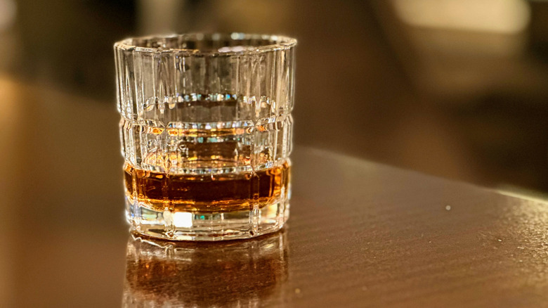 A clear glass of bourbon