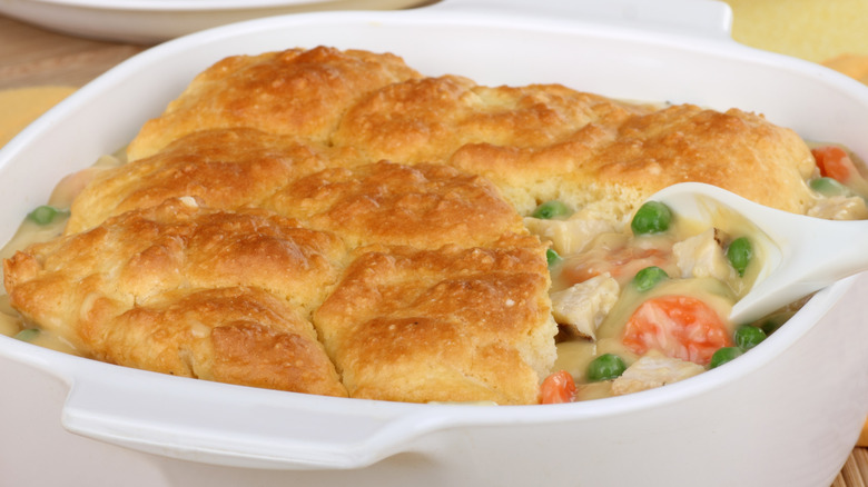 Close up of chicken pot pie casserole topped with biscuits