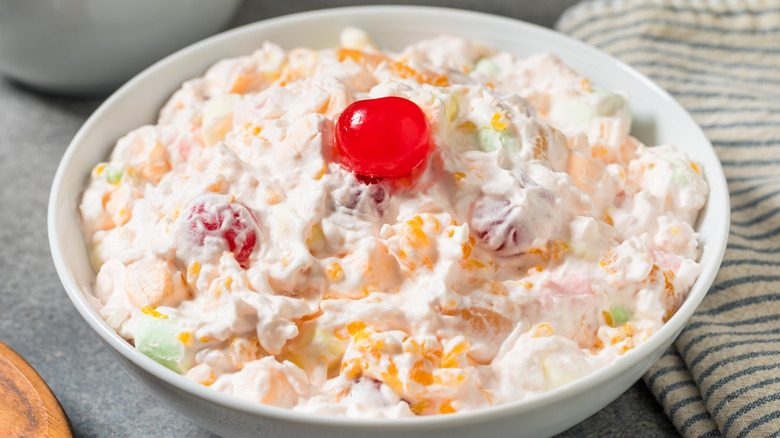 Homemade ambrosia salad with a cherry on top
