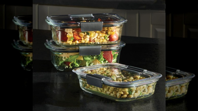 3 of the 9 total food containers in this set shown filled with assorted food
