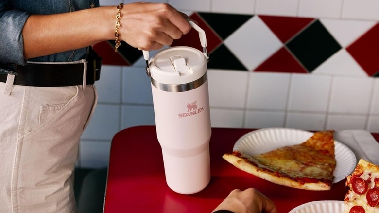 A hand holding the Stanley IceFlow 2.0