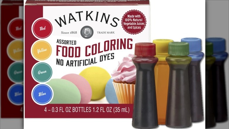 Watkins Assorted Food Coloring box next to four food dye bottles