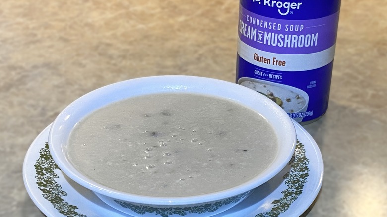 Kroger gluten free cream of mushroom condensed soup in bowl next to can