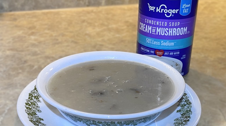 Kroger less sodium condensed cream of mushroom soup in bowl next to can