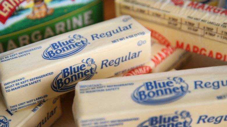 Two packaged sticks of margarine