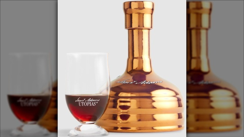 A bottle and glass of Sameul Adams Utopias
