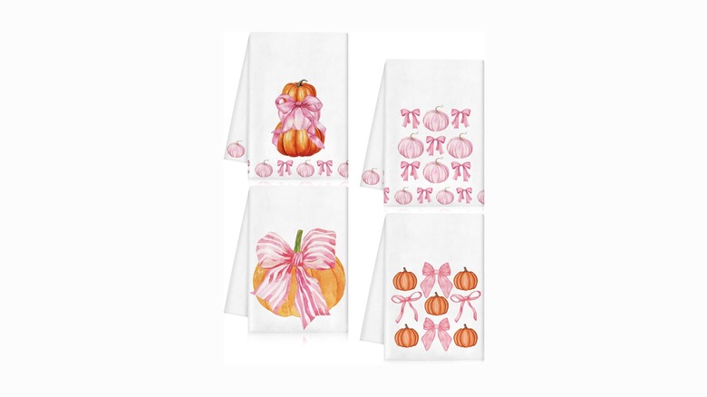 Four pumpkin-themed kitchen towels with pink details