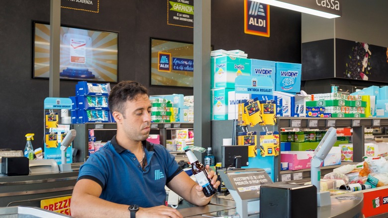 An Aldi cashier scans items in one of its stores